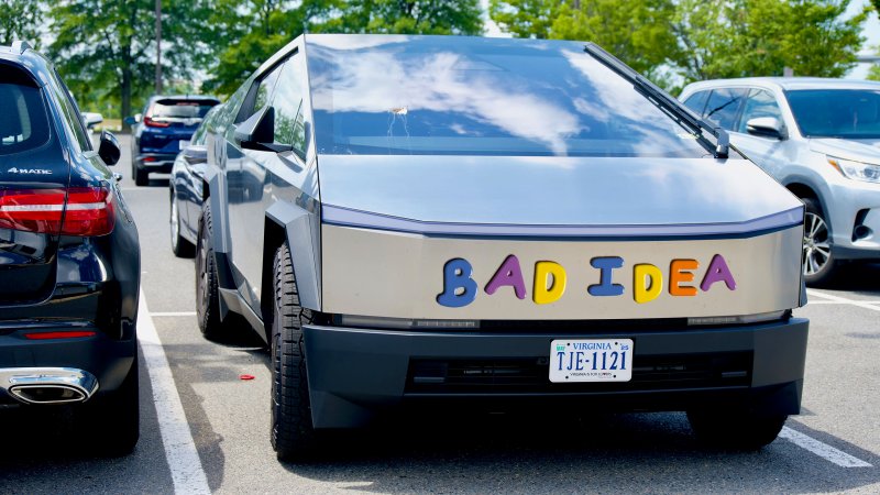Getty stock image of the front of a Tesla Cybertruck with alphabetic magnets photoshopped onto the front, spelling "BAD IDEA."
