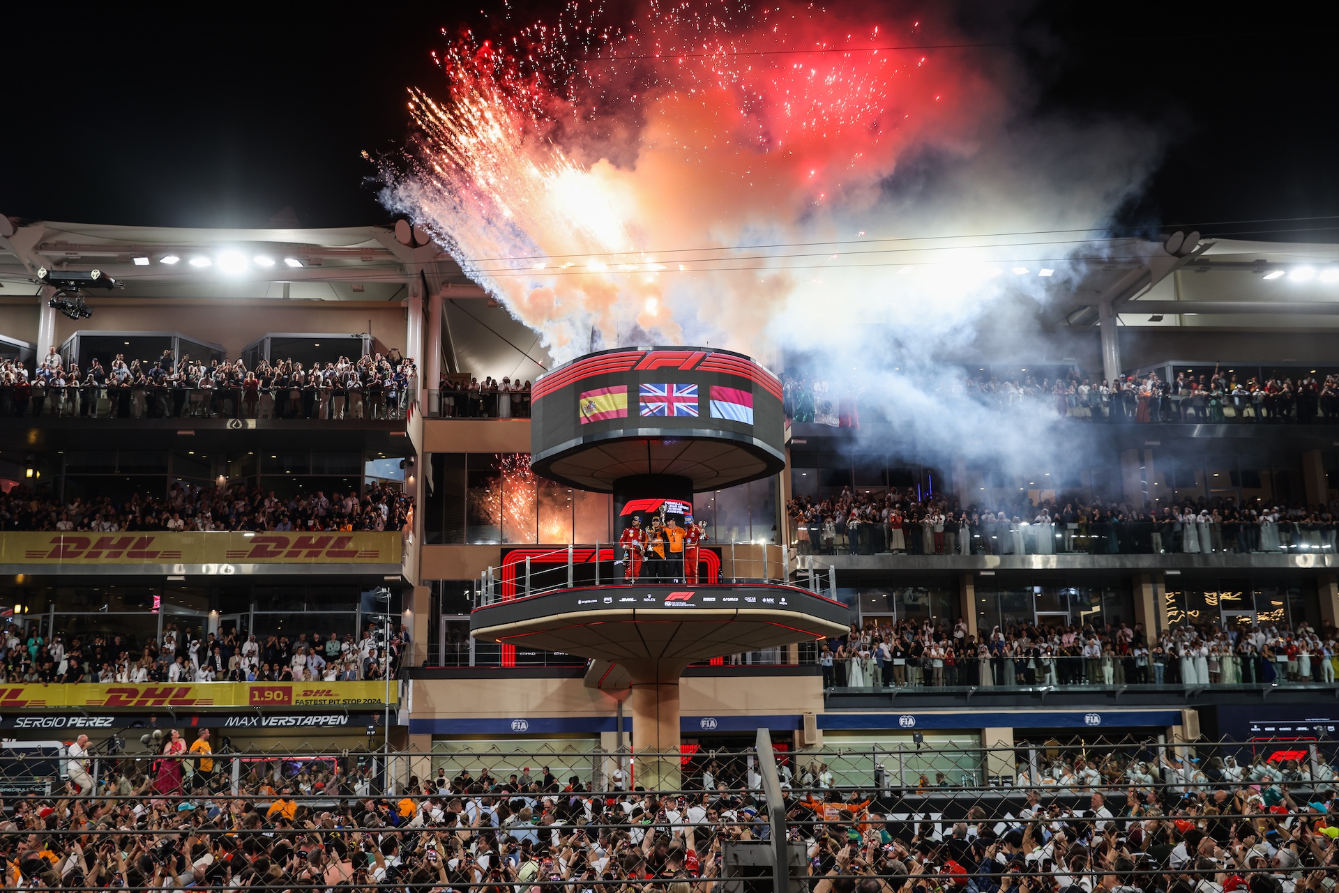 Lando Norris of McLaren, Carlos Sainz of Ferrari, Charles Leclerc of Ferrari and and Zak Brown of McLaren celebrate on the podium during Formula 1 Abu Dhabi Grand Prix at Yas Marina Circuit on December 8th, 2024 in Abu Dhabi, United Arab Emirates. (Photo by Beata Zawrzel/NurPhoto)