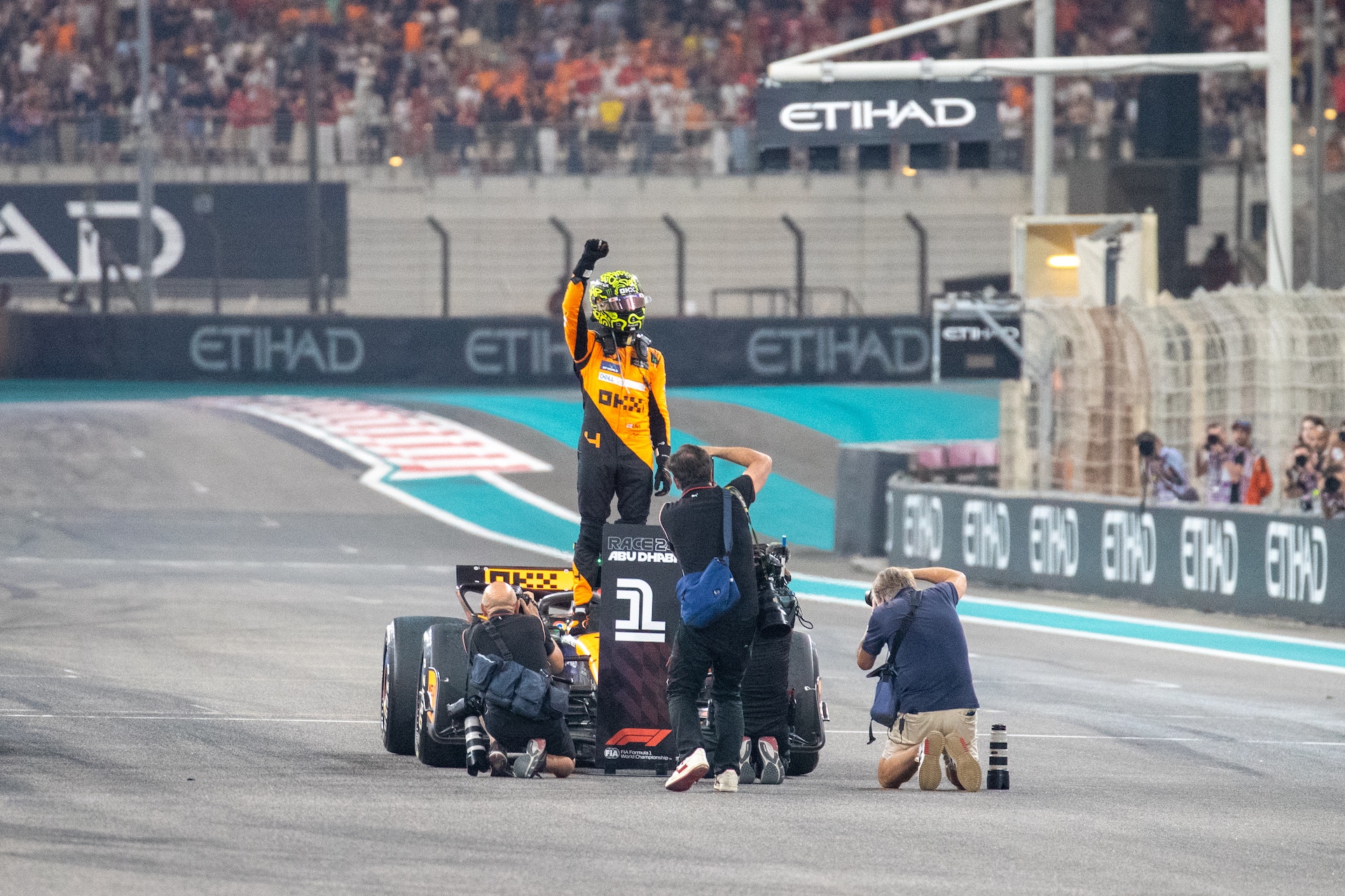 Lando Norris of the UK drives the McLaren F1 Team MCL38 Mercedes and celebrates a win during the Formula 1 Etihad Airways Abu Dhabi Grand Prix in Abu Dhabi, United Arab Emirates, on December 8, 2024. (Photo by Alessio Morgese/NurPhoto via Getty Images)
