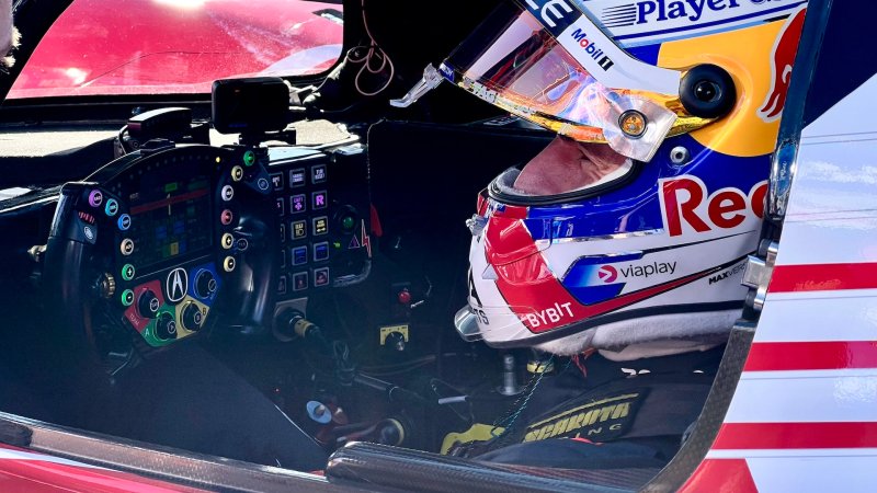 Max Verstappen sitting in Acura IMSA GTP race car.